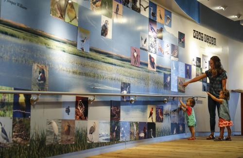 Family visiting Bear River Migratory Bird Refuge Visitor Center in Box Elder County 